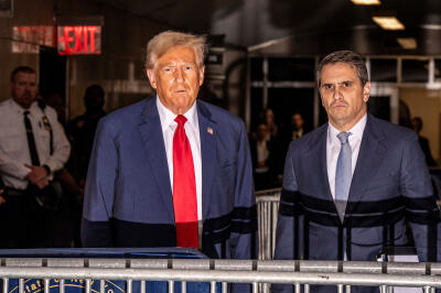 Former US president Donald Trump and his lawyer, Todd Blanche, leaving Manhattan Criminal Court in New York, April 25, 2024.