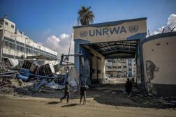 Palestinians in front of destroyed UNRWA buildings in Gaza City, February 10, 2024.