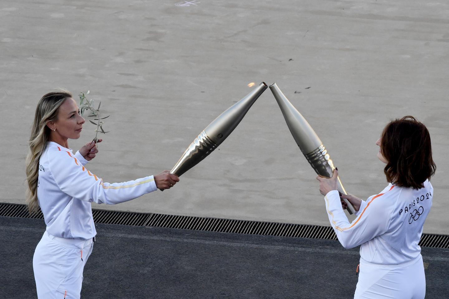 Greece hands Olympic flame to 2024 Paris Games hosts