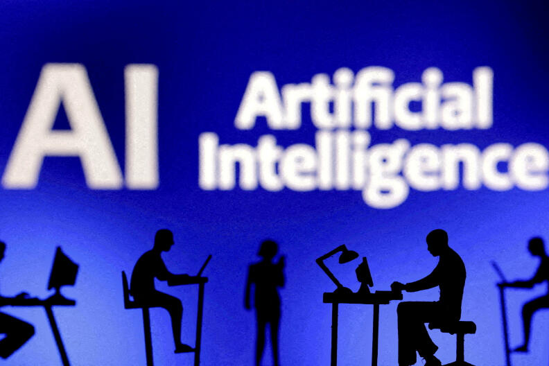 FILE PHOTO: Figurines with computers and smartphones are seen in front of the words "Artificial Intelligence AI" in this illustration taken, February 19, 2024. REUTERS/Dado Ruvic/Illustration//File Photo
