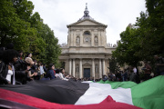 Students demonstrate outside Sorbonne university with a huge Palestinian flag, Monday, April 29, 2024 in Paris.