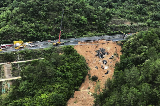 Rescue workers intervene in a collapsed section of highway in Meizu, China, on May 2, 2024.