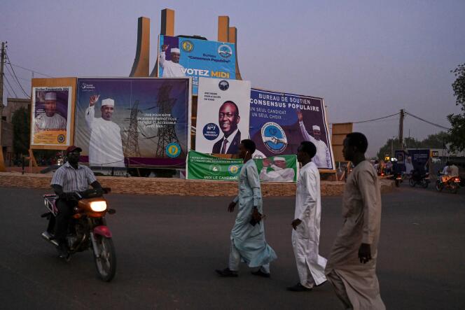 Election posters depicting Mahamat Idriss Déby and Succès Masra, candidates in the May 6 presidential election, on a street in N'Djamena, the Chadian capital, on May 2, 2024.