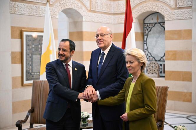 Lebanon's Prime Minister Najib Mikati (C) poses for a picture with European Commission President Ursula von der Leyen and Cypriot President Nikos Christodoulides at the government headquarters in Beirut on May 2, 2024. 