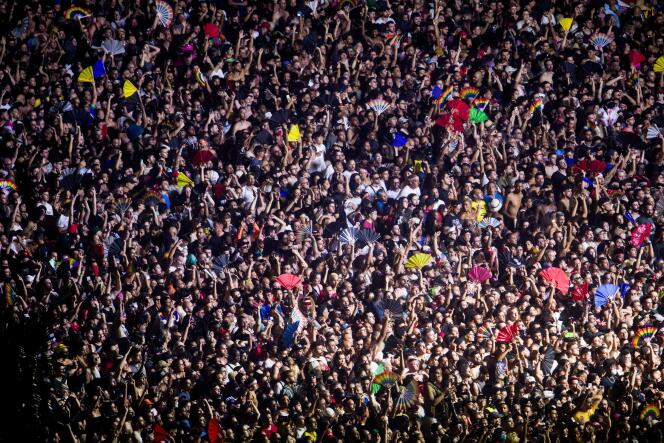 The crowd enjoys the opening show of US DJ Diplo before the performance of US pop star Madonna at a free concert at Copacabana beach in Rio de Janeiro, Brazil, on May 4, 2024.