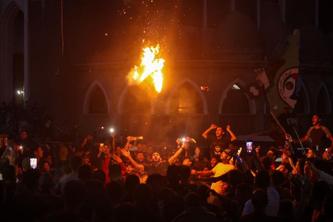 Palestinians celebrate Hamas's announcement that it has accepted a ceasefire plan on a street in Rafah, south of the Gaza Strip, on May 6, 2024.