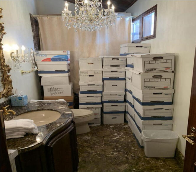 This undated file image, released by the US District Court Southern District of Florida, attached as evidence in the indictment against former US president Donald Trump shows stacks of boxes in a bathroom and shower allegedly in the Lake Room at Mar-a-Lago, the former president's private club.