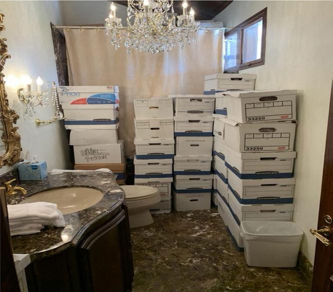 This undated file image, released by the US District Court Southern District of Florida, attached as evidence in the indictment against former US president Donald Trump shows stacks of boxes in a bathroom and shower allegedly in the Lake Room at Mar-a-Lago, the former president's private club.