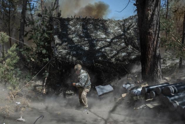 Gunners from a unit of the 12th Azov Brigade fire their 152mm Giatsint-B cannon at Russian positions after receiving the order by radio. On the outskirts of Lyman, Donbas, Ukraine, May 4, 2024.