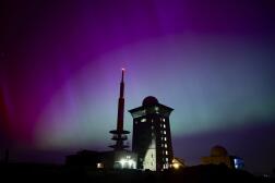 Northern lights appear in the night sky above the Brocken early on May 11, 2024, in Schierke, northern Germany.