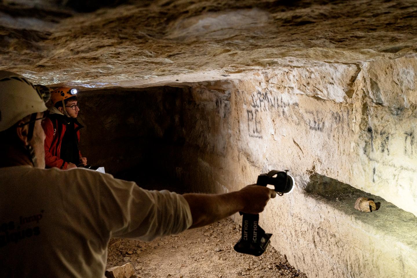 In an underground quarry in Normandy, archeologists trace the people who hid from D-Day bombings