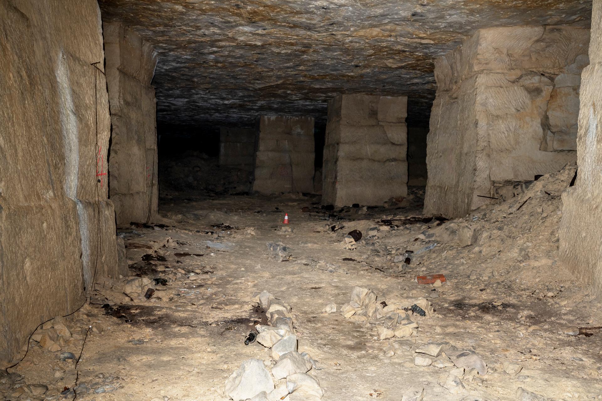 Stones arranged in a line mark the living spaces of each family, sometimes crammed with a dozen people, in the Saingt brewery quarry refuge in Fleury-sur-Orne, France, April 29, 2024.