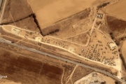 Aerial view showing Israeli military vehicles gathering near the Gaza Strip's Kerem Shalom border crossing on May 3, 2024.