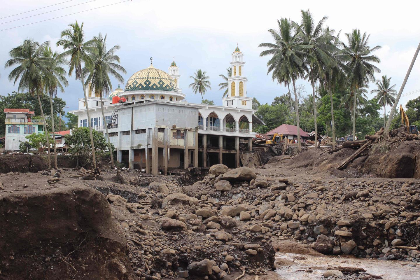 Indonesia rescue teams search in rivers as flash floods kill at least 50