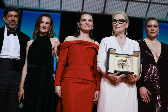 Meryl Streep, awarded with an Honorary Palme d'Or Award, poses with Juliette Binoche, Master of Ceremony Camille Cottin, Jury President Greta Gerwig, and jury member Pierfrancesco Favino at the 77th Cannes Film Festival in Cannes, France, May 14, 2024. 