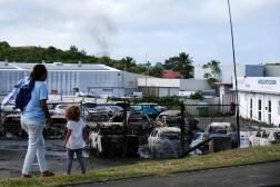 Cars burned at a car dealership in the Belle-Vie district of Nouméa, on May 14, 2024.