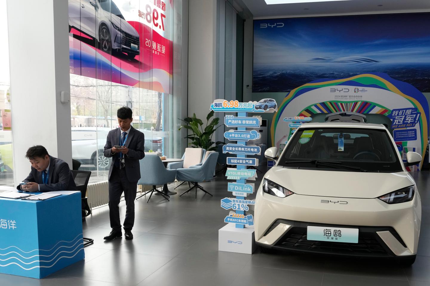 Under pressure from Trump, Biden hits Chinese electric cars with higher tariffs