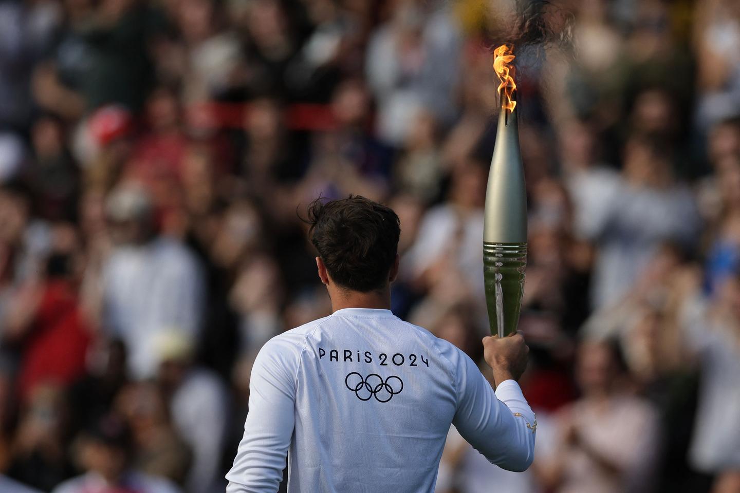 New Caledonia removed from Olympic torch's route following unrest