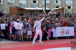 Decathlete Kevin Mayer carries the flame in Montpellier on Monday May 13.