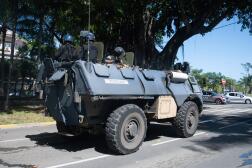 Gendarmerie officers depart from a police station on an armoured vehicle in Noumea, France's Pacific territory of New Caledonia, on May 18, 2024.