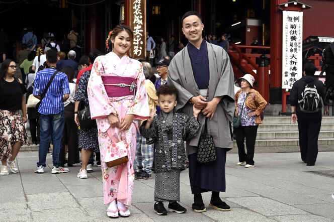 A couple in traditional dress while visiting a temple in Tokyo's Asakusa district, October 15, 2019.