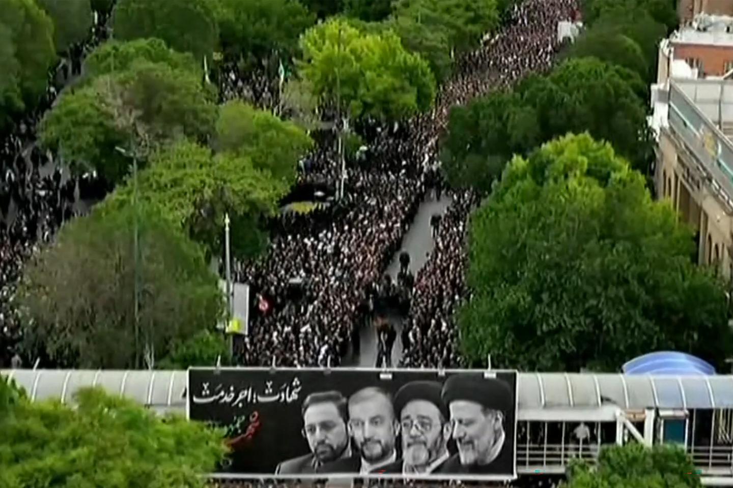 Tens of thousands of Iranians line the streets to pay last respects to president killed in helicopter crash