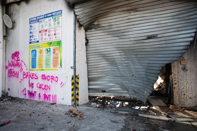 Graffiti in the burnt-out Le Froid drinks factory in the pro-independence district of Montravel, Nouméa, New Caledonia, May 23, 2024.