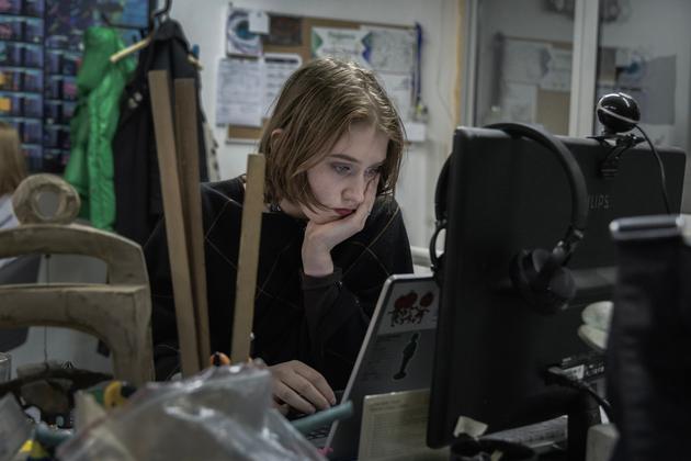 Taissia Krivko, 18, at her desk in the Yermilov Art Center in Kharkiv, Ukraine, May 17, 2024.
