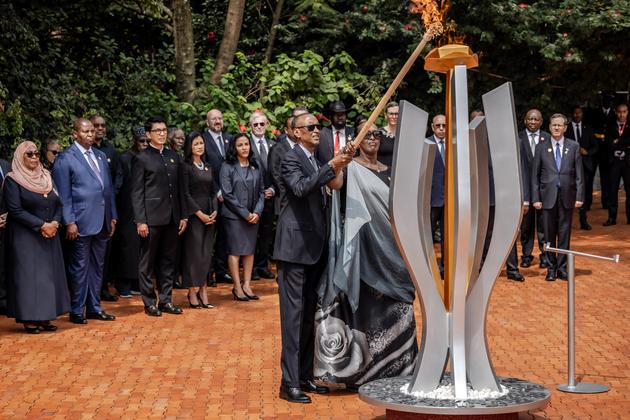 Rwandan President Paul Kagame and his wife Jeannette Kagame light the flame at the Gisozi Genocide Memorial in Kigali, Rwanda, on April 7, 2024.