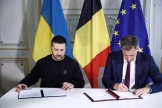 Ukraine's President Volodymyr Zelensky and Belgian Prime Minister Alexander De Croo sign a bilateral security accord in Brussels on May 28, 2024.