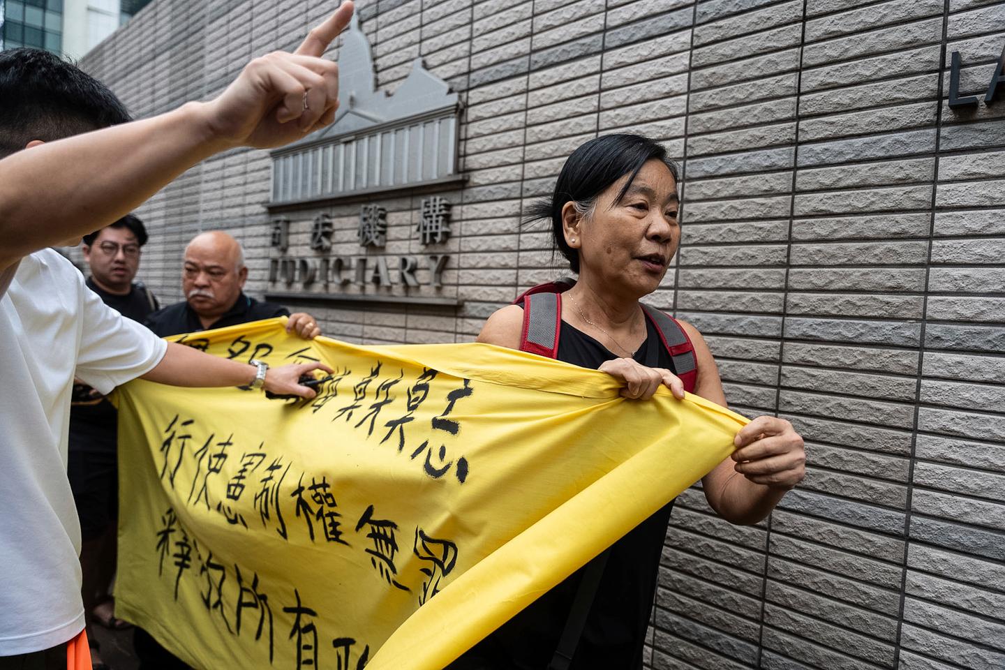 Hong Kong court convicts 14 pro-democracy activists in city's biggest national security case