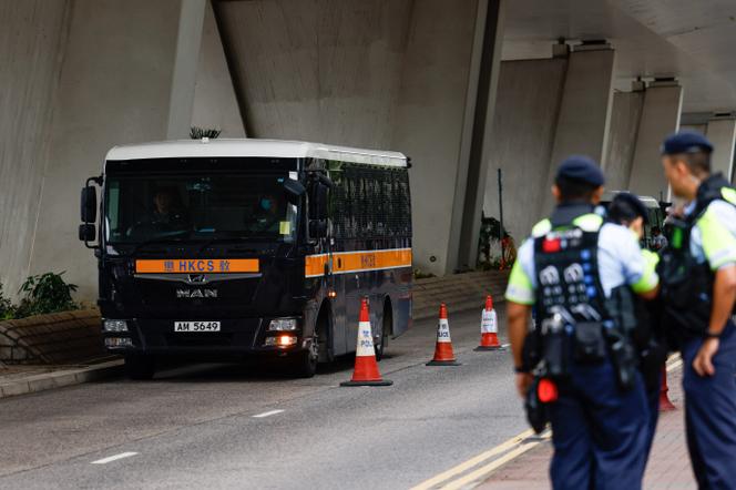 A bus of detainees arrives at the West Kowloon Court in Hong Kong on May 30, 2024.