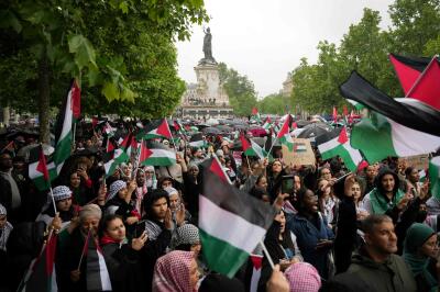 Protesters wave Palestinian during a demonstration in Paris on June 1, 2024.