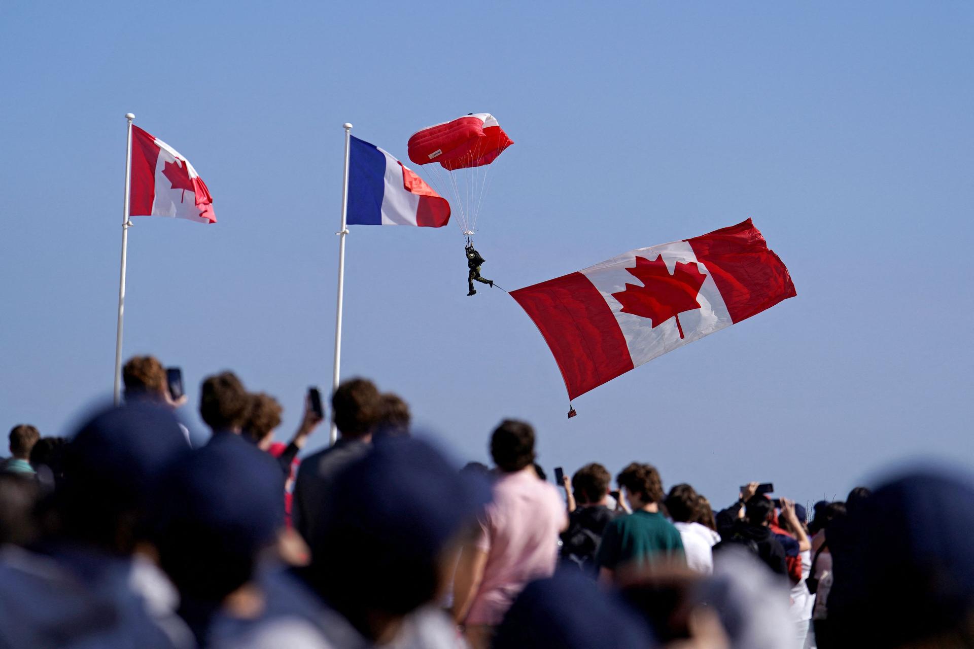 Parachutists drop in ahead of the Canadian commemorative ceremony at the British Normandy Memorial at the Juno Beach Centre, Courseulles-sur-Mer, Normandy on the northern coast of France, as part of the events to mark the 80th anniversary commemorations of Allied amphibious landing in France in 1944, on June 6, 2024. 