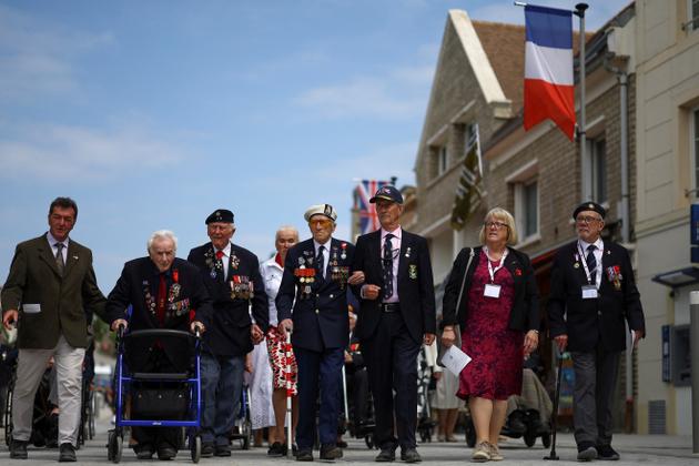 British Veterans take part in a parade to mark the 80th anniversary of D-Day at Arromanches, Normandy region, France, June 6, 2024. REUTERS/Hannah McKay