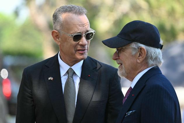 US actor Tom Hanks (L) and US director Steven Spielberg (R) attend the US ceremony marking the 80th anniversary of the World War II "D-Day" Allied landings in Normandy, at the Normandy American Cemetery and Memorial in Colleville-sur-Mer, June 6, 2024.