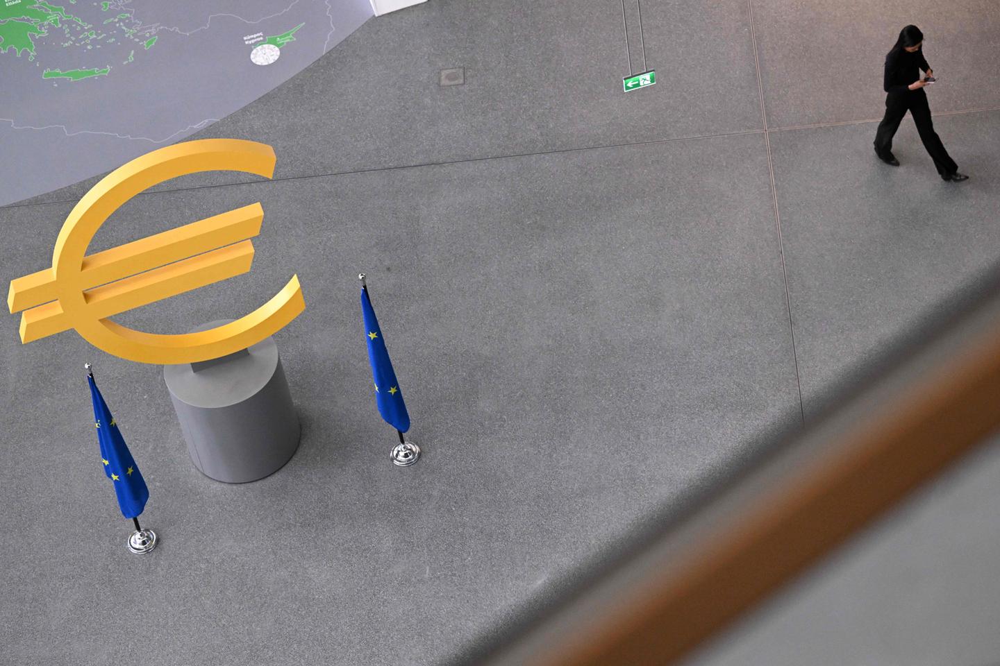 ECB cuts key rate by quarter point, but raises inflation forecast