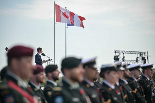 France's Prime Minister Gabriel Attal delivers a speech during the Canadian commemorative ceremony at the Juno Beach Centre near the village of Courseulles-sur-Mer, in northwestern France, on June 6, 2024. 