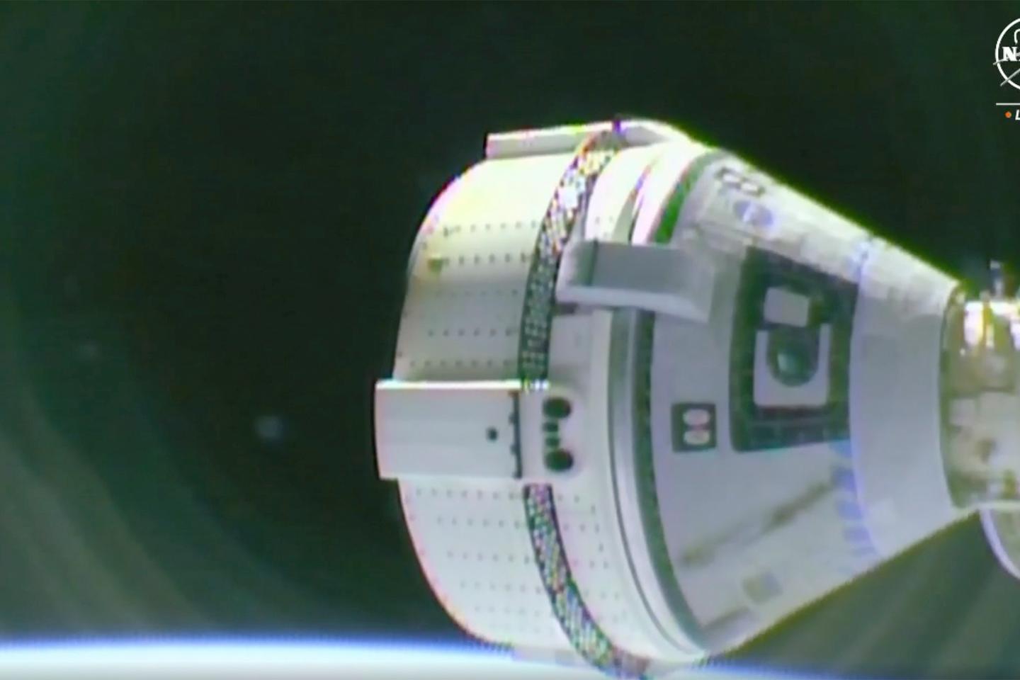 Starliner at the space station after thruster trouble