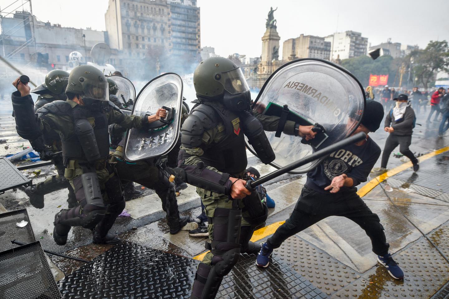 Argentine riot police disperse protesters with water cannons and tear gas ahead of key Senate vote