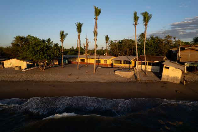 Palm trees overlook buildings destroyed by rising water in the Gulf of Fonseca, southern Honduras, February 2024.