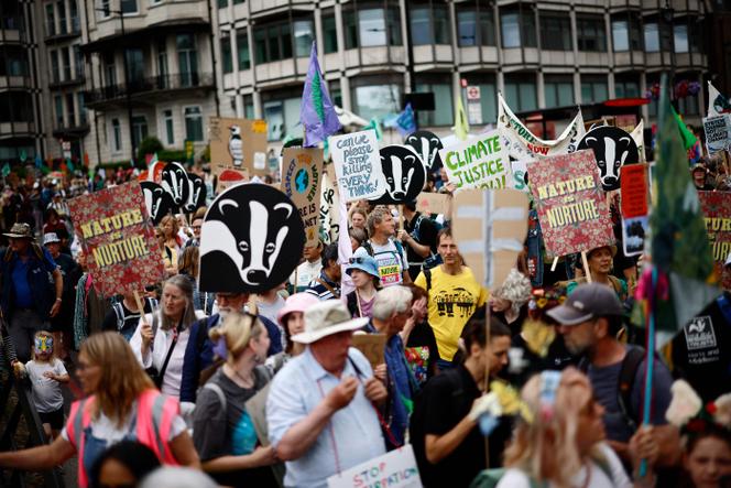 People demonstrate to protect nature and climate organized in London, Saturday, June 22, 2024. 