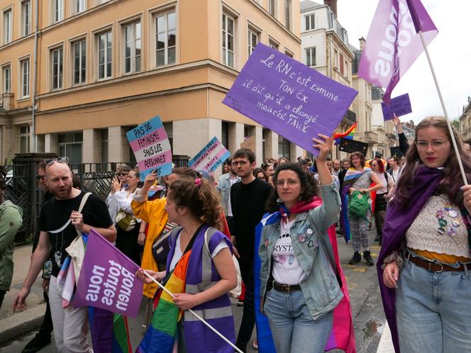 'I needed to be with people who understand the urgency for our community' | WN24 1 Alexane, 25, bisexual flag on her shoulders and placard held high, is attending her second Rouen Pride, on June 22, 2024.
