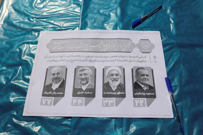 A paper showing the presidential candidates is pictured during the snap presidential election to choose a successor to Ebrahim Raisi following his death in a helicopter crash, in Tehran, Iran June 28, 2024.
