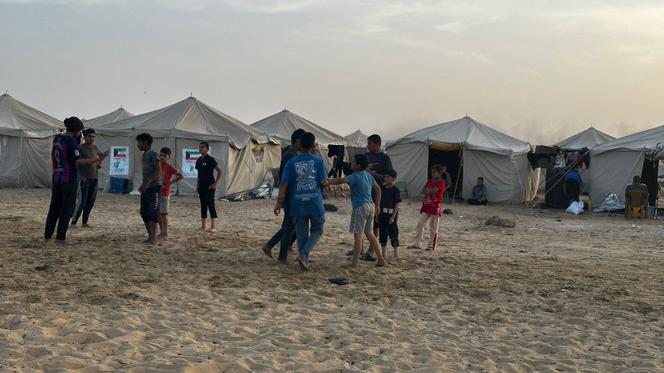 Palestinian children in a camp in the Gaza Strip town of Khan Yunis, home to orphans, widows and displaced divorced women, April 25, 2024.