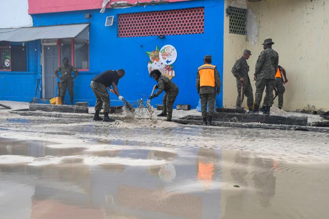 Hurricane Beryl strengthens to 'potentially catastrophic' Category 5 storm | WN24 7 Staff from the Barbados Defence Force clear sand from the south coast's main road after the passage of Hurricane Beryl in Christ Church, Barbados, on July 1, 2024.