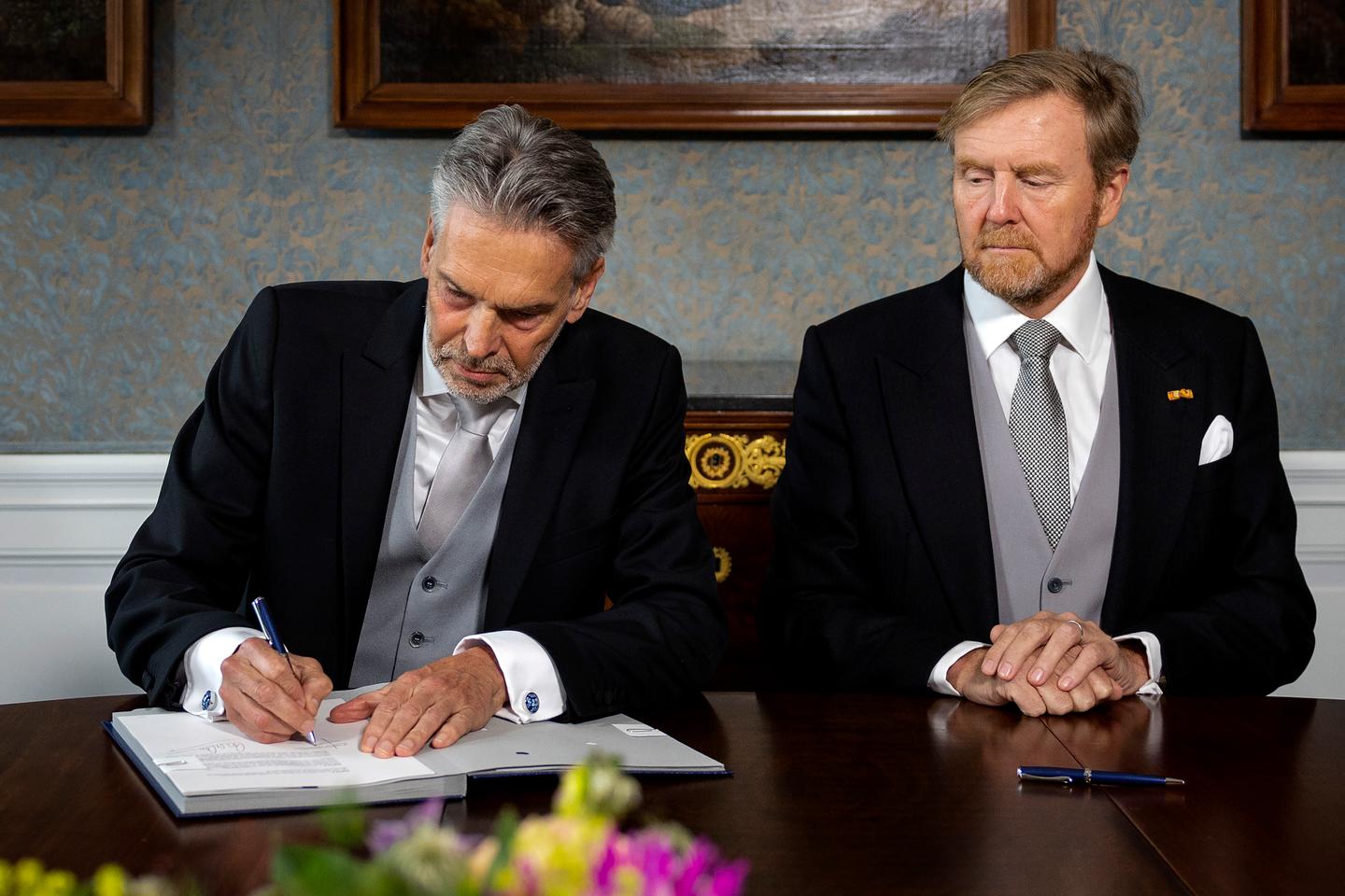 Dutch king swears in a new government 7 months after far right won elections