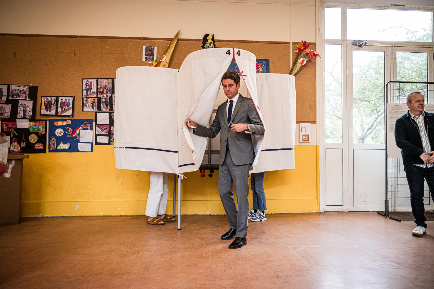 French elections: Macron's camp, projected to come in second, avoids a major defeat