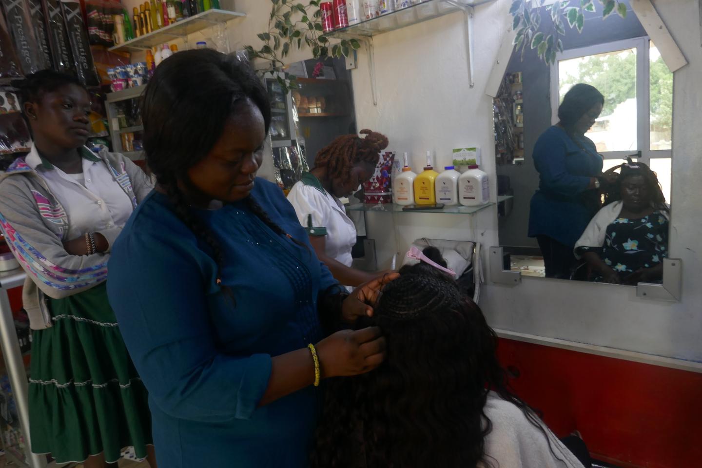 In West Africa, hairdressers are on the front line, helping clients with mental health problems