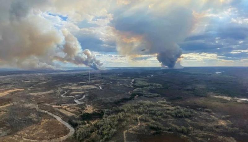 This image, released by Alberta Wildfire, shows columns of smoke columns of smoke in the forested area of Fort McMurray, Alberta (Canada), May 13, 2024